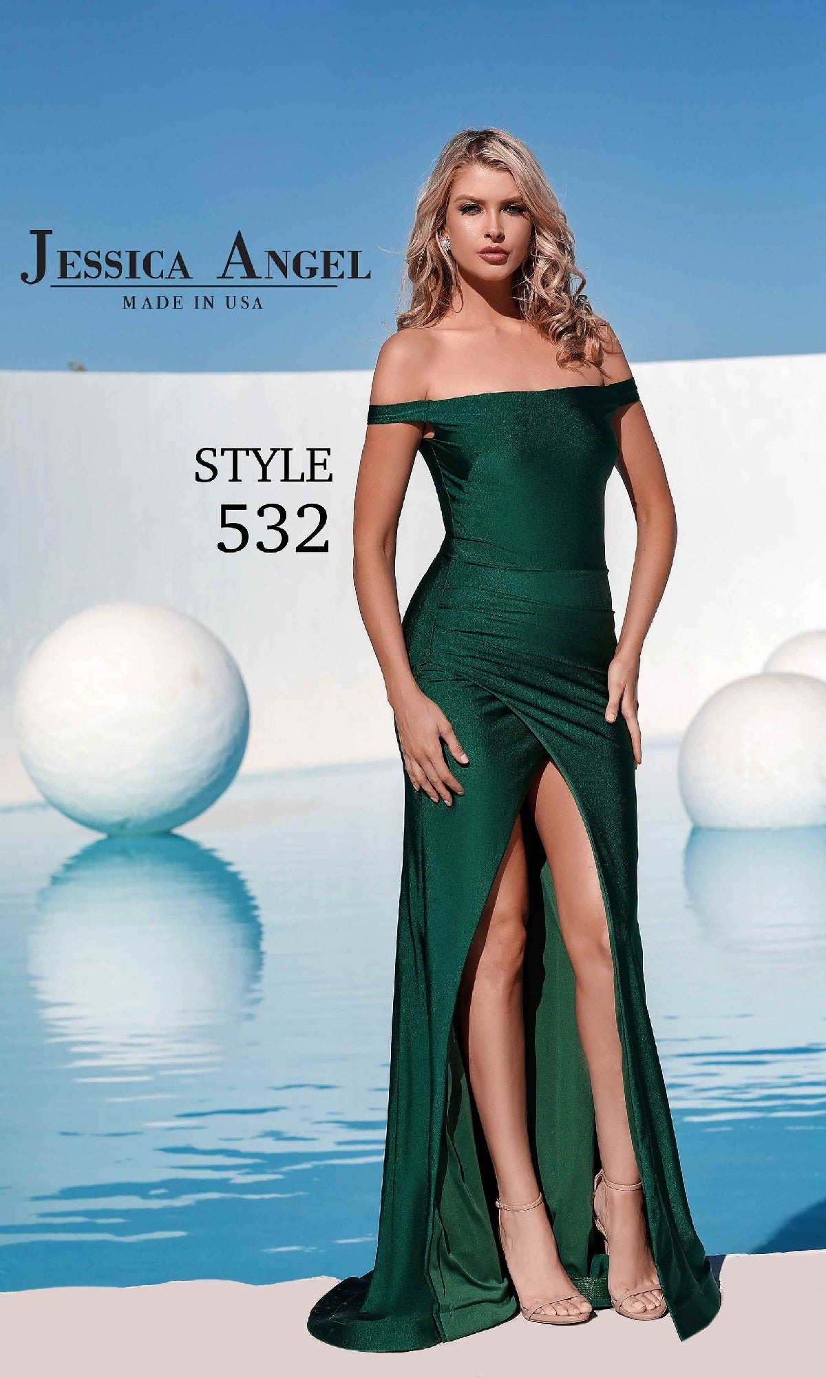 Woman in a dark green Faux-Wrap Long Prom Dress: Jessica Angel 532 with off-the-shoulder neckline and thigh-high slit, posing by a pool with white spherical decor. Text reads